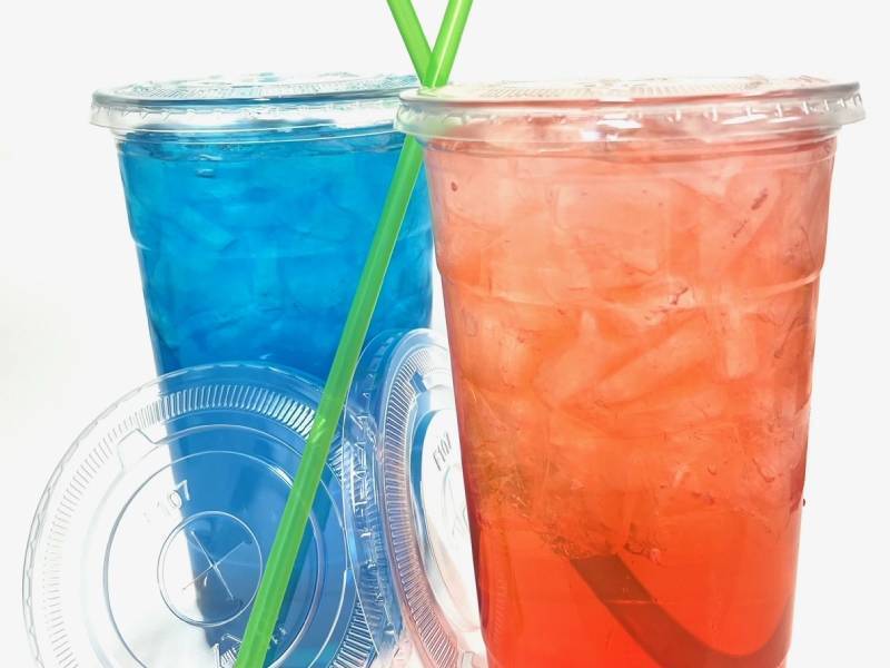 Zoomed in view of two cups of different flavored beverages